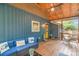 A screened-in porch features cozy seating and view to the backyard at 1724 Virginia St, Monroe, NC 28110