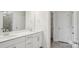 Bathroom with double sinks, white cabinets, tile floor, and enclosed shower at 2031 Skyhawk Dr, York, SC 29745