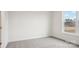 Bright bedroom featuring carpet flooring, white walls, and a window with an outdoor view at 2031 Skyhawk Dr, York, SC 29745