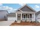 Charming single-Gathering home boasting a covered porch, gray siding, and a well-manicured lawn at 2031 Skyhawk Dr, York, SC 29745