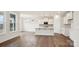 Spacious kitchen seamlessly connects to the dining area with hardwood floors and ample natural light at 2031 Skyhawk Dr, York, SC 29745