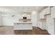 Well-designed kitchen with a central island, tile backsplash, and white cabinetry at 2031 Skyhawk Dr, York, SC 29745