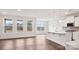 Open-concept living area featuring hardwood floors, and abundant light from large windows at 2031 Skyhawk Dr, York, SC 29745