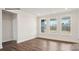Bright bedroom with hardwood floors, neutral walls, and multiple windows offering natural light at 2053 Skyhawk Dr, York, SC 29745