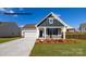 Charming single-story home featuring stone accents, a two-car garage, and a well-manicured lawn at 2053 Skyhawk Dr, York, SC 29745