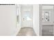 Well-lit foyer featuring modern flooring, a glass-panel front door, and a view into the adjacent room at 2053 Skyhawk Dr, York, SC 29745