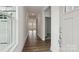 Bright foyer showcasing hardwood floors, neutral paint, and an open transition into the living spaces at 2053 Skyhawk Dr, York, SC 29745
