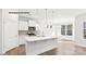 Open-concept kitchen featuring a large island, stainless steel appliances, and hardwood floors at 2053 Skyhawk Dr, York, SC 29745