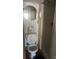Modest bathroom featuring a toilet, round mirror, and stand-up shower at 216 Maple St, Statesville, NC 28677
