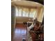 Sunlit living room with hardwood floors and large windows with views at 216 Maple St, Statesville, NC 28677