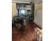 Spacious living room with hardwood floors, an aquarium, and adjacent dining area at 216 Maple St, Statesville, NC 28677