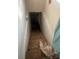 Basement staircase leading down to an unfinished area at 216 Maple St, Statesville, NC 28677