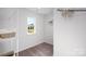 Walk-in closet with wire shelving and natural light from a window at 222 Giant Oak Ave, Statesville, NC 28677
