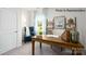 Bright office space featuring a wooden desk, a blue chair and decor shelves at 222 Giant Oak Ave, Statesville, NC 28677
