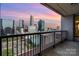 Relax on this balcony with stunning city skyline views and black metal railings at 222 S Caldwell St # 1909, Charlotte, NC 28202