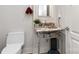 Stylish half bathroom with decorative sink and a modern touch at 222 S Caldwell St # 1909, Charlotte, NC 28202