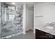 Elegant bathroom with a luxurious marble glass-enclosed shower and granite countertops at 222 S Caldwell St # 1909, Charlotte, NC 28202