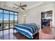 Bright bedroom with large windows, hardwood floors, and a spacious walk-in closet at 222 S Caldwell St # 1909, Charlotte, NC 28202