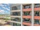 Exterior shot of a modern high-rise building with balconies and large windows at 222 S Caldwell St # 1909, Charlotte, NC 28202