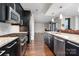 Well-equipped kitchen with stainless steel appliances and a large open layout at 222 S Caldwell St # 1909, Charlotte, NC 28202
