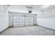 Spacious garage with high ceilings, concrete floor, and an insulated door for easy entry and added security at 231 Miramar Dr, York, SC 29745