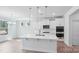 Modern kitchen features white cabinetry, stainless steel appliances, and a large island at 231 Miramar Dr, York, SC 29745
