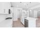 Well-equipped kitchen with stainless steel appliances, island with sink, and sleek design at 231 Miramar Dr, York, SC 29745