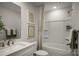Bright bathroom featuring a shower-tub combination, framed art, and neutral-toned walls at 3055 Finchborough Ct # 218, Charlotte, NC 28269