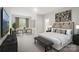Comfortable bedroom with neutral tones, large windows, and stylish decor at 3055 Finchborough Ct # 218, Charlotte, NC 28269