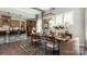 Open dining area with hardwood floors, modern lighting fixture, and adjacent to the kitchen at 3099 Trace Meadow Ct, York, SC 29745