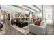 Open-concept living area with hardwood floors, comfortable seating, and adjacent kitchen and dining room at 3099 Trace Meadow Ct, York, SC 29745