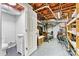 Unfinished basement includes a functioning toilet with small sink, and exposed rafters at 312 Rumple St, Troutman, NC 28166