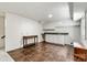 Finished basement includes a wet bar with white cabinets, tile flooring, and additional storage space at 312 Rumple St, Troutman, NC 28166
