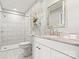 Clean bathroom features a marble countertop, white cabinets, a full shower, and marble tile flooring at 312 Rumple St, Troutman, NC 28166