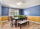 Cozy dining room with a modern table set and stylish decor, perfect for Gathering dinners at 312 Rumple St, Troutman, NC 28166