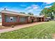Charming brick home with manicured lawn and landscaping, offering great curb appeal at 312 Rumple St, Troutman, NC 28166