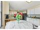 Bright kitchen features granite countertops, white cabinetry, stainless steel appliances, and a stylish breakfast nook at 312 Rumple St, Troutman, NC 28166