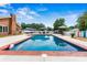 Backyard features a sparkling in-ground pool with a gazebo and patio furniture for relaxing and entertaining at 312 Rumple St, Troutman, NC 28166