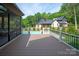 Beautiful backyard with deck leading to a pool and hot tub, perfect for outdoor relaxation at 3524 Lacie Ln, Charlotte, NC 28211