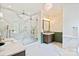 Luxurious bathroom featuring marble walk-in shower, double shower heads, and floral wallpaper accent wall at 3524 Lacie Ln, Charlotte, NC 28211