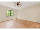 Spacious bedroom features a ceiling fan, hardwood floors and natural light at 3524 Lacie Ln, Charlotte, NC 28211