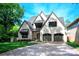 Stunning two-story home featuring a symmetrical facade and gray-tone brick at 3524 Lacie Ln, Charlotte, NC 28211