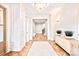 Elegant foyer with hardwood floors, decorative molding, and a chandelier at 3524 Lacie Ln, Charlotte, NC 28211