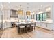 Bright kitchen featuring a large island, pendant lighting, stainless appliances, and ample counter space at 3524 Lacie Ln, Charlotte, NC 28211