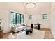 Bright living area with large windows, vaulted ceilings, and herringbone floors at 3524 Lacie Ln, Charlotte, NC 28211