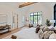 Bright primary bedroom with vaulted ceilings and beams, and large windows with views to the outdoors at 3524 Lacie Ln, Charlotte, NC 28211