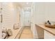 Mudroom with built-in bench, storage, white shiplap walls, and side table at 3524 Lacie Ln, Charlotte, NC 28211