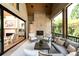 Covered outdoor patio with fireplace and comfortable seating for relaxing and entertaining at 3524 Lacie Ln, Charlotte, NC 28211