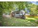 Lovely home with a spacious backyard, surrounded by mature trees, offering plenty of room to relax and enjoy the outdoors at 3529 Trent St, Charlotte, NC 28209