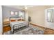 Bedroom with hardwood flooring, natural light, neutral colors, and ceiling fan at 3529 Trent St, Charlotte, NC 28209
